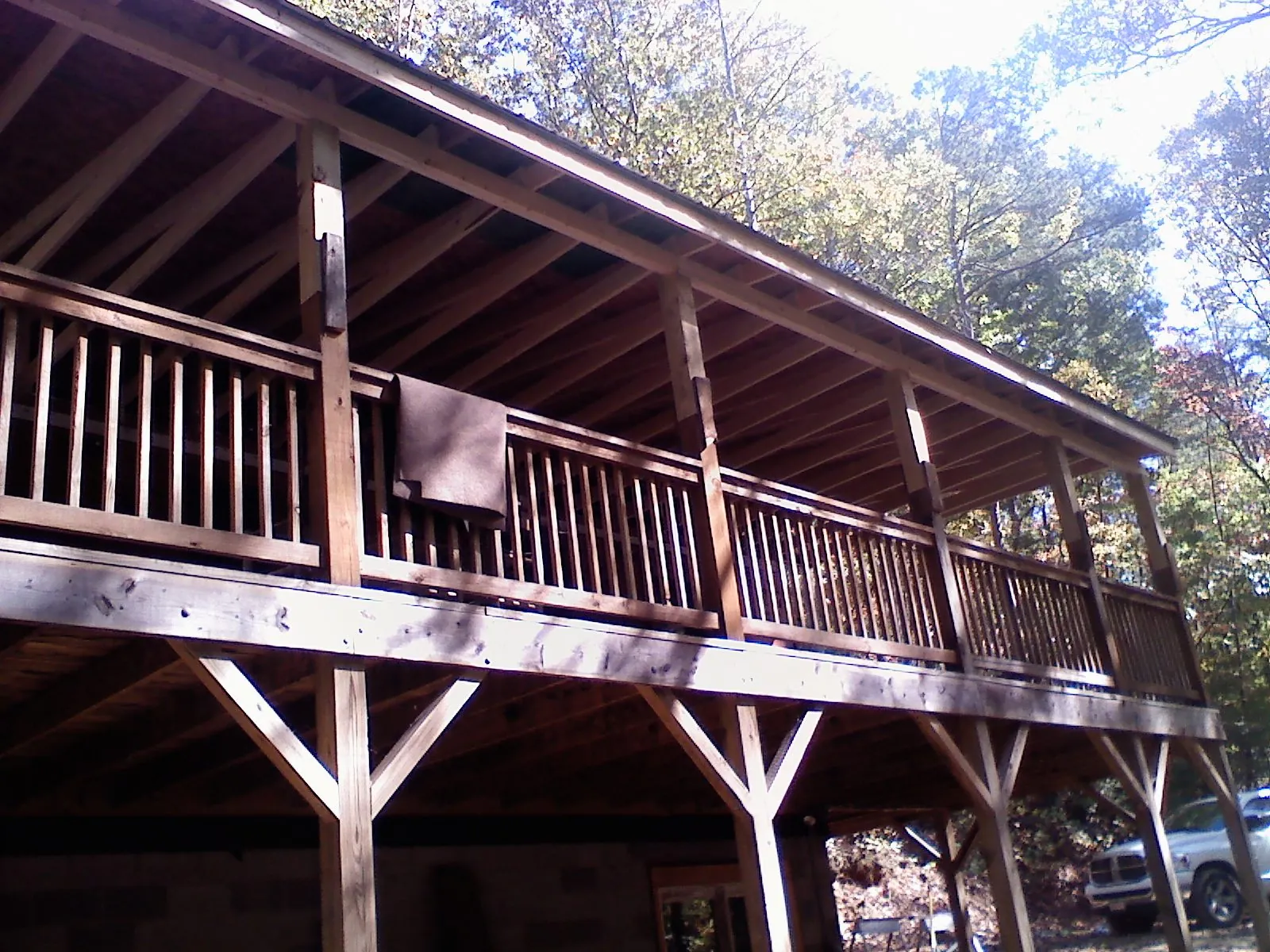 Timber framing under a new elevated porch and deck — Roof Leak Repair in Bigelow by Roofing Brothers